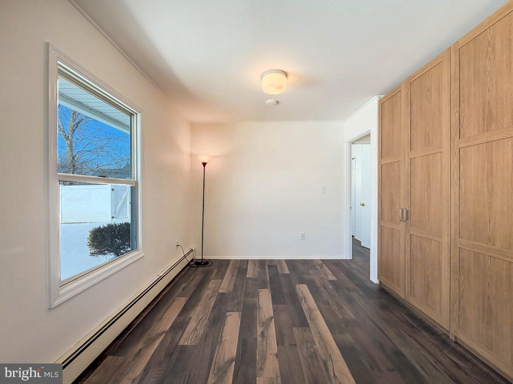 19 Butterfly Lane Levittown, PA 19054 - Photo 24 of 32 a view of a room with wooden floor ceiling fan and window