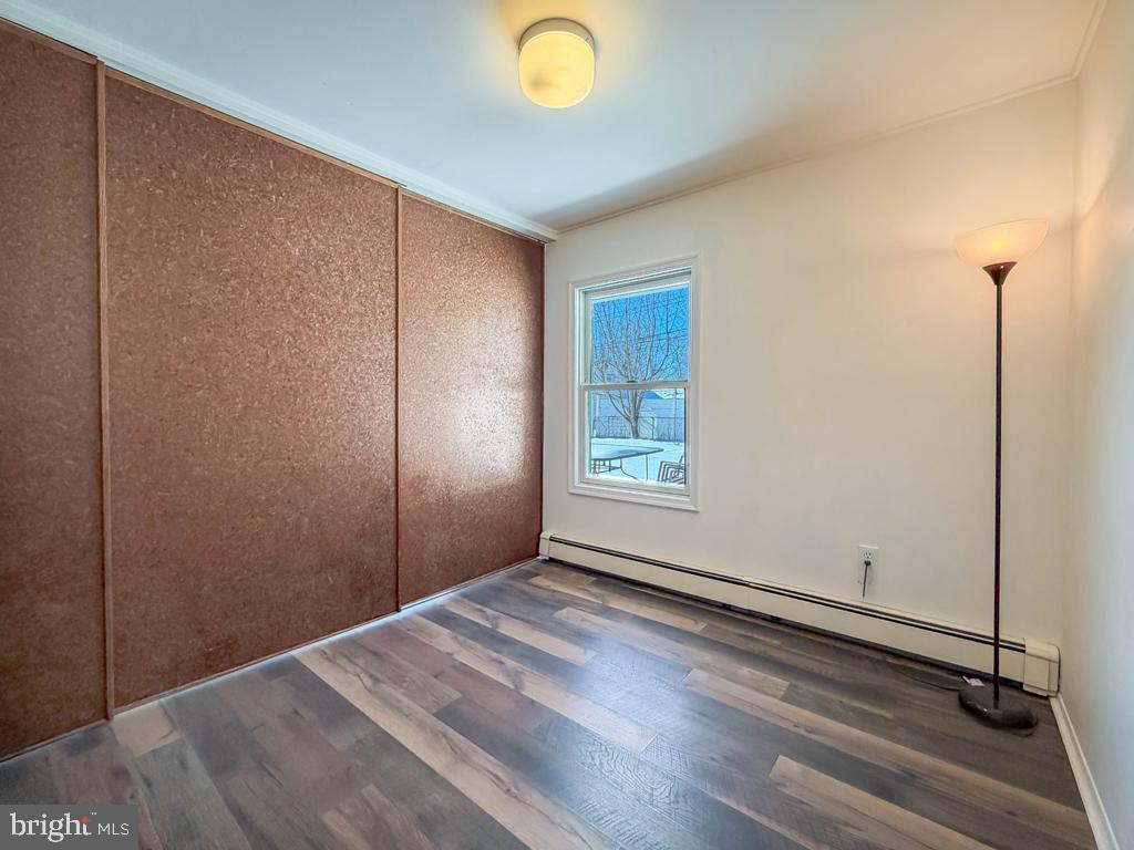 19 Butterfly Lane Levittown, PA 19054 - Photo 25 of 32 a view of empty room with window and wooden floor