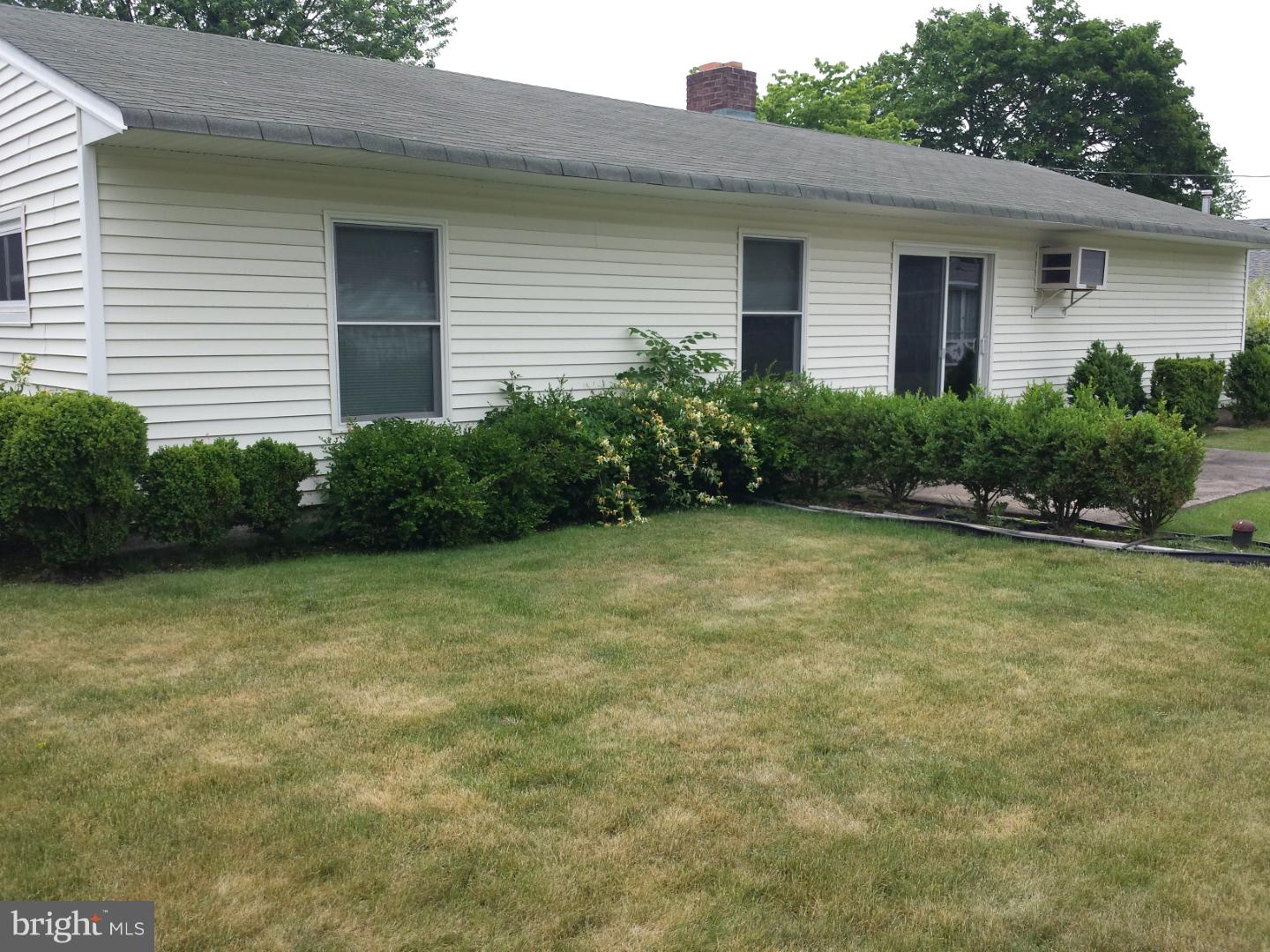 19 Butterfly Lane Levittown, PA 19054 - Photo 29 of 32 a view of a backyard with plants and large tree