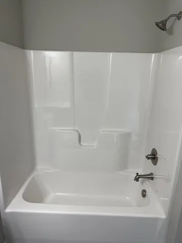 a kitchen with stainless steel appliances a stove a microwave and sink