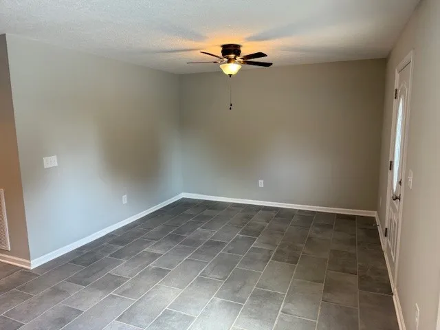 an empty room with closet area