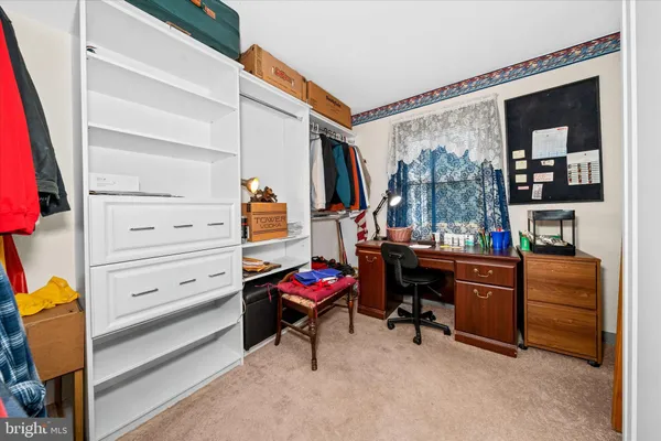 a bedroom with a bunk bed and a desk