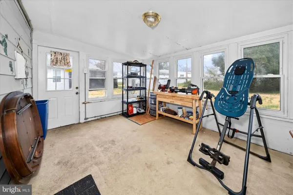 a bedroom with furniture and a window