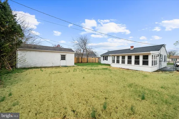 a front view of house with yard and entertaining space