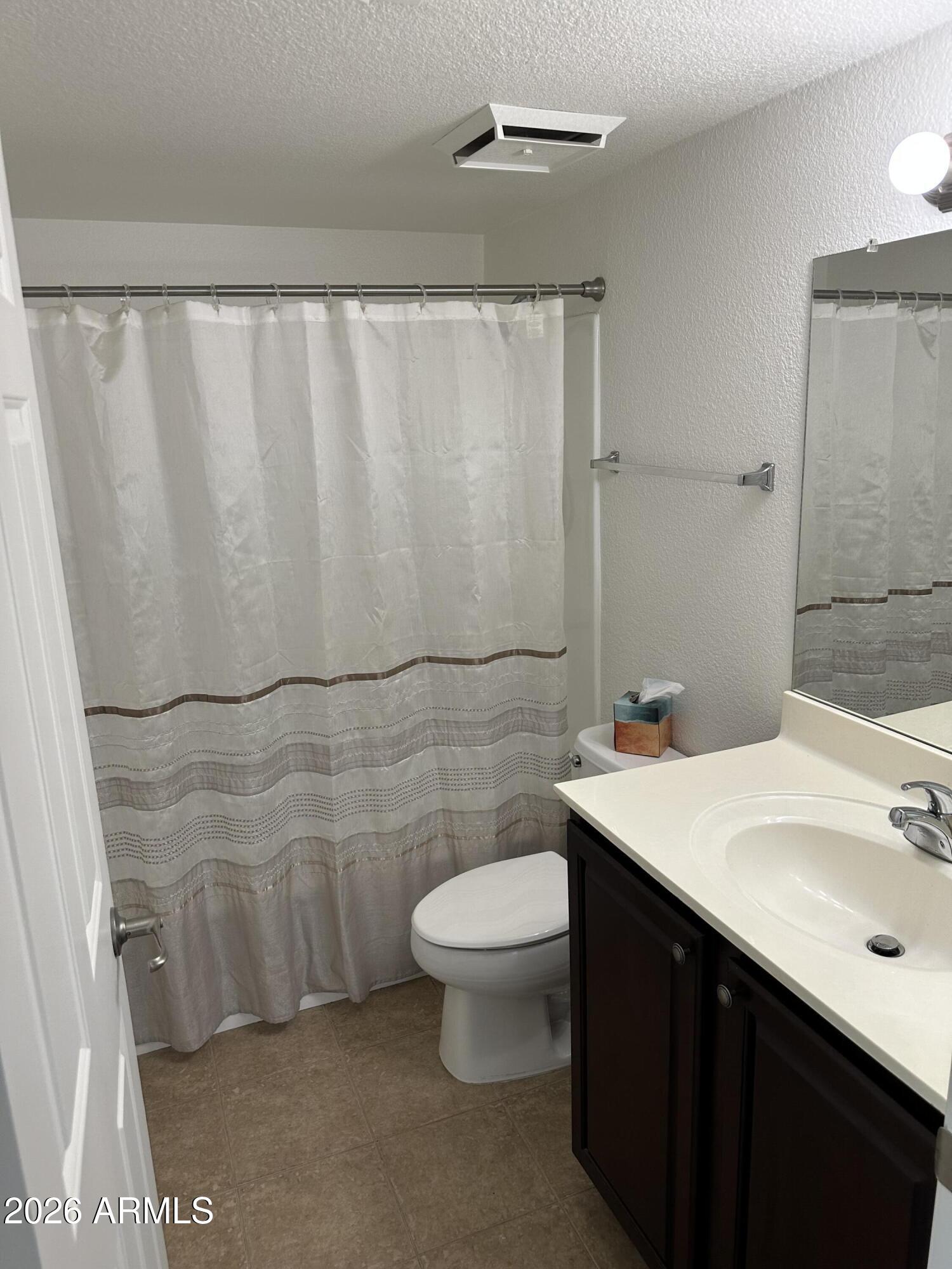 1720 East Thunderbird Road, Unit 1019 Phoenix, AZ 85022 - Photo 32 of 47 a bathroom with a sink and a mirror