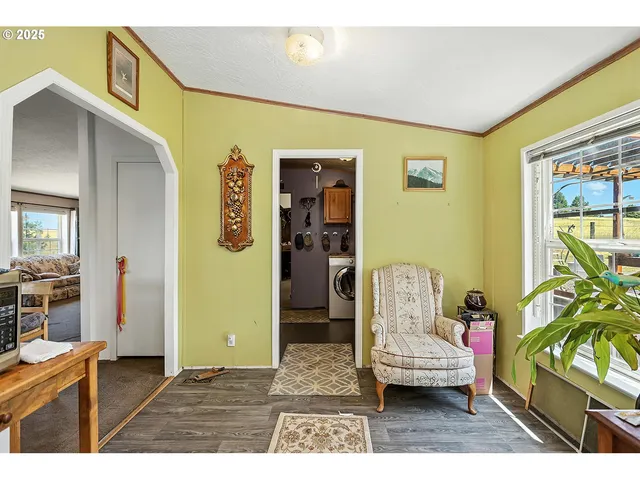 a living room with furniture and a dining area