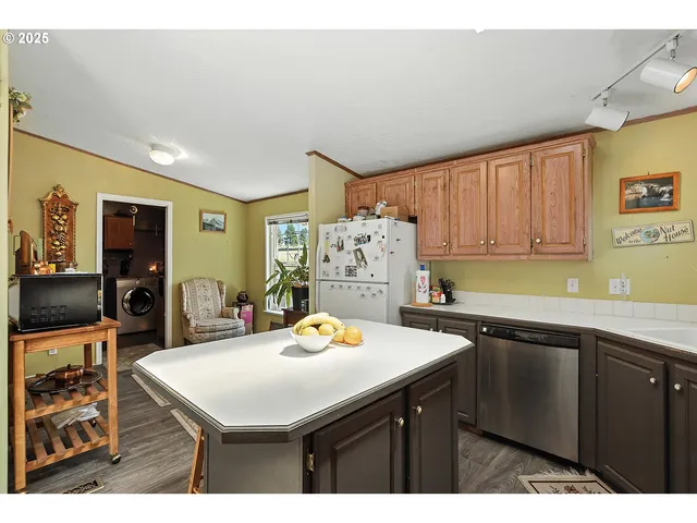 a kitchen with a sink a stove and cabinets
