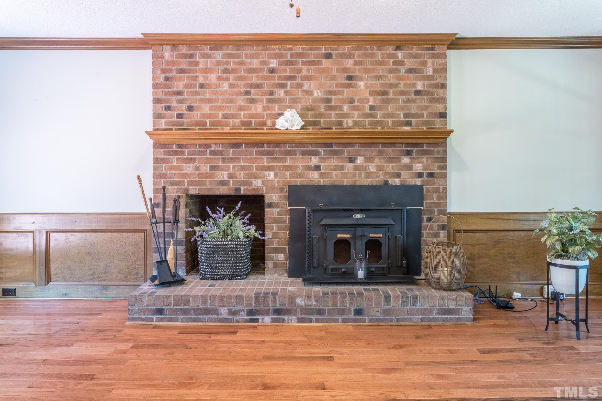 2700 Farnborough Road Raleigh, NC 27613 - Photo 12 of 36 a living room with a fireplace