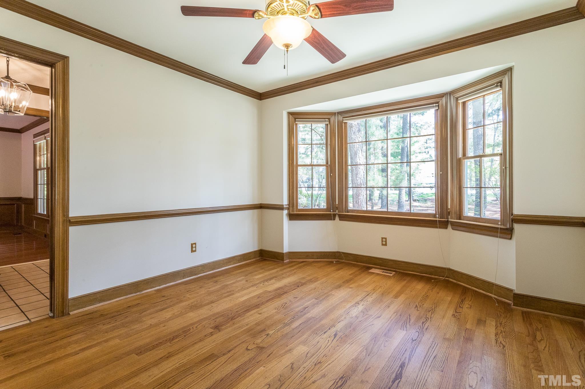 2700 Farnborough Road Raleigh, NC 27613 - Photo 19 of 36 a view of an empty room with wooden floor and a window