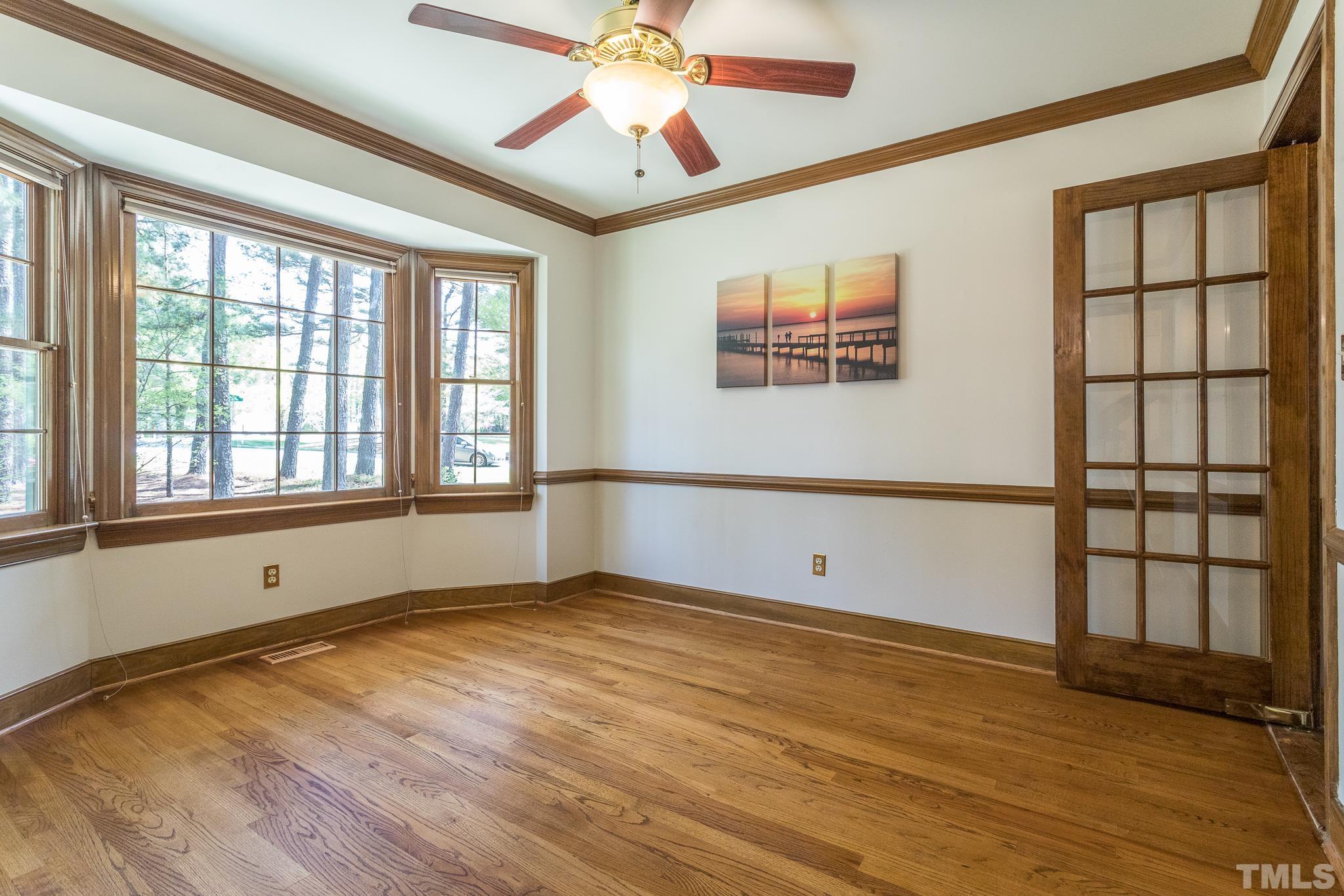 2700 Farnborough Road Raleigh, NC 27613 - Photo 20 of 36 a view of an empty room with window and wooden floor