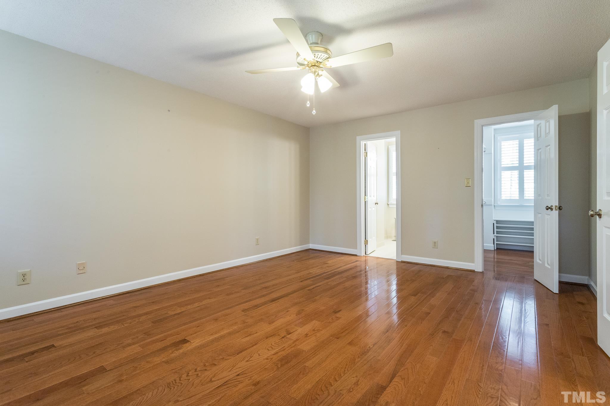 2700 Farnborough Road Raleigh, NC 27613 - Photo 23 of 36 wooden floor in an empty room with a window
