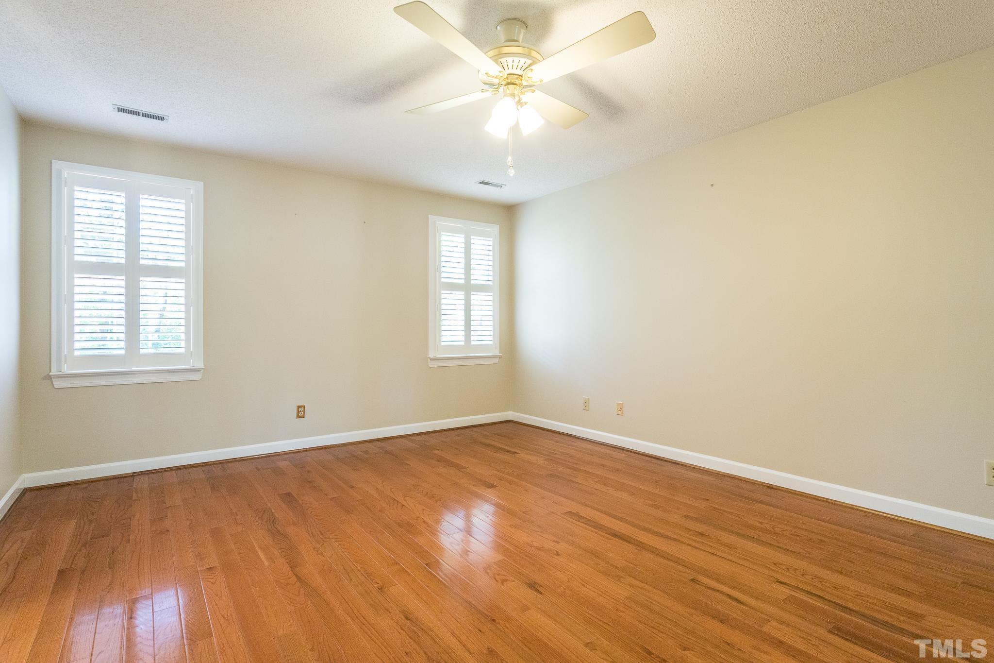 2700 Farnborough Road Raleigh, NC 27613 - Photo 26 of 36 wooden floor in an empty room with a window