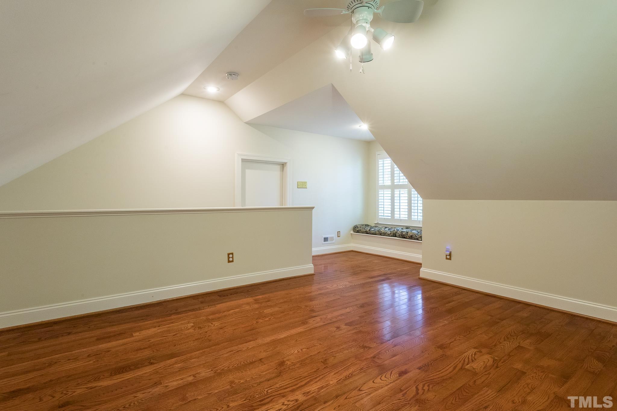 2700 Farnborough Road Raleigh, NC 27613 - Photo 30 of 36 an empty room with wooden floor and windows