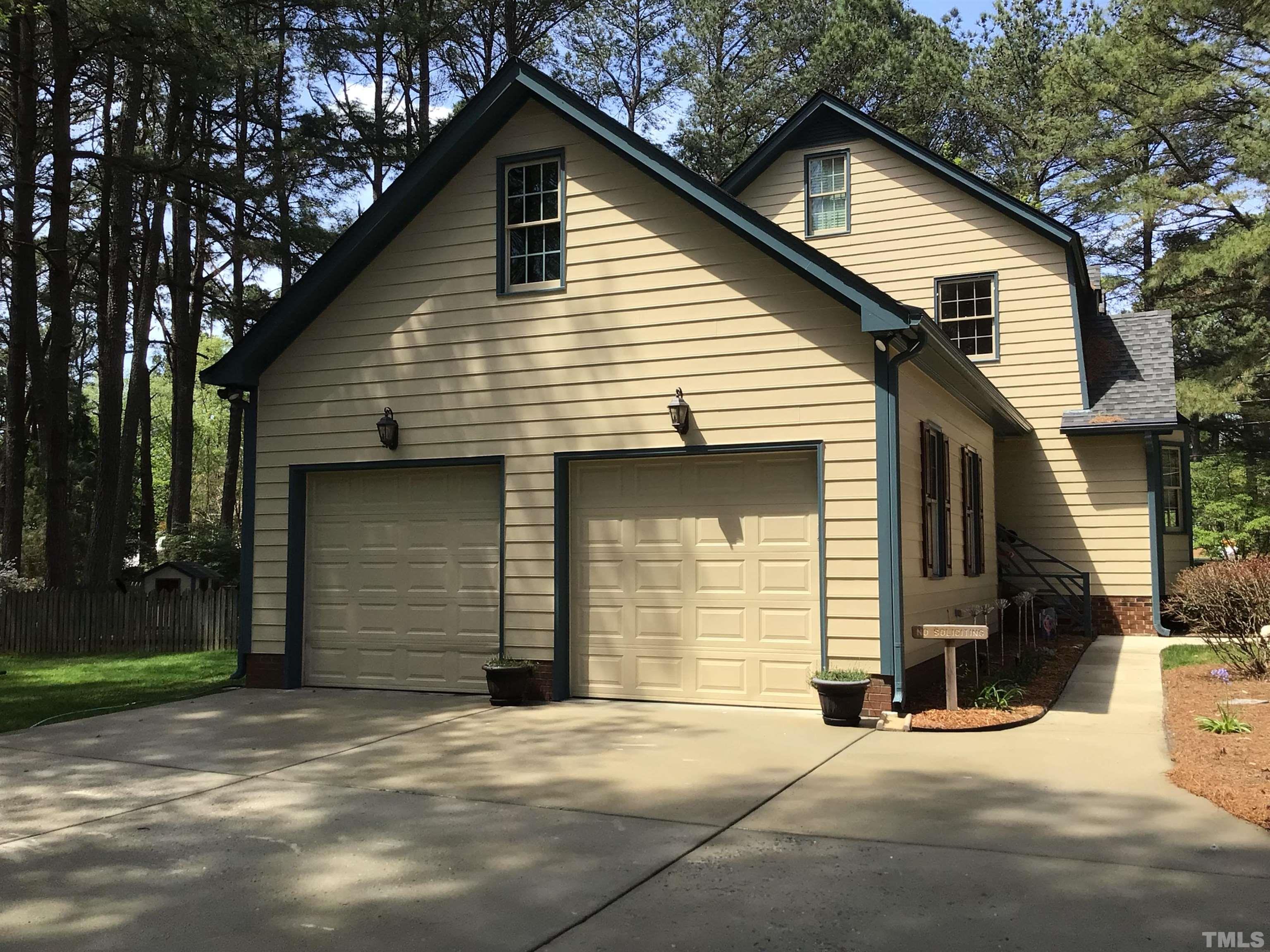 2700 Farnborough Road Raleigh, NC 27613 - Photo 3 of 36 a front view of a house with a garage
