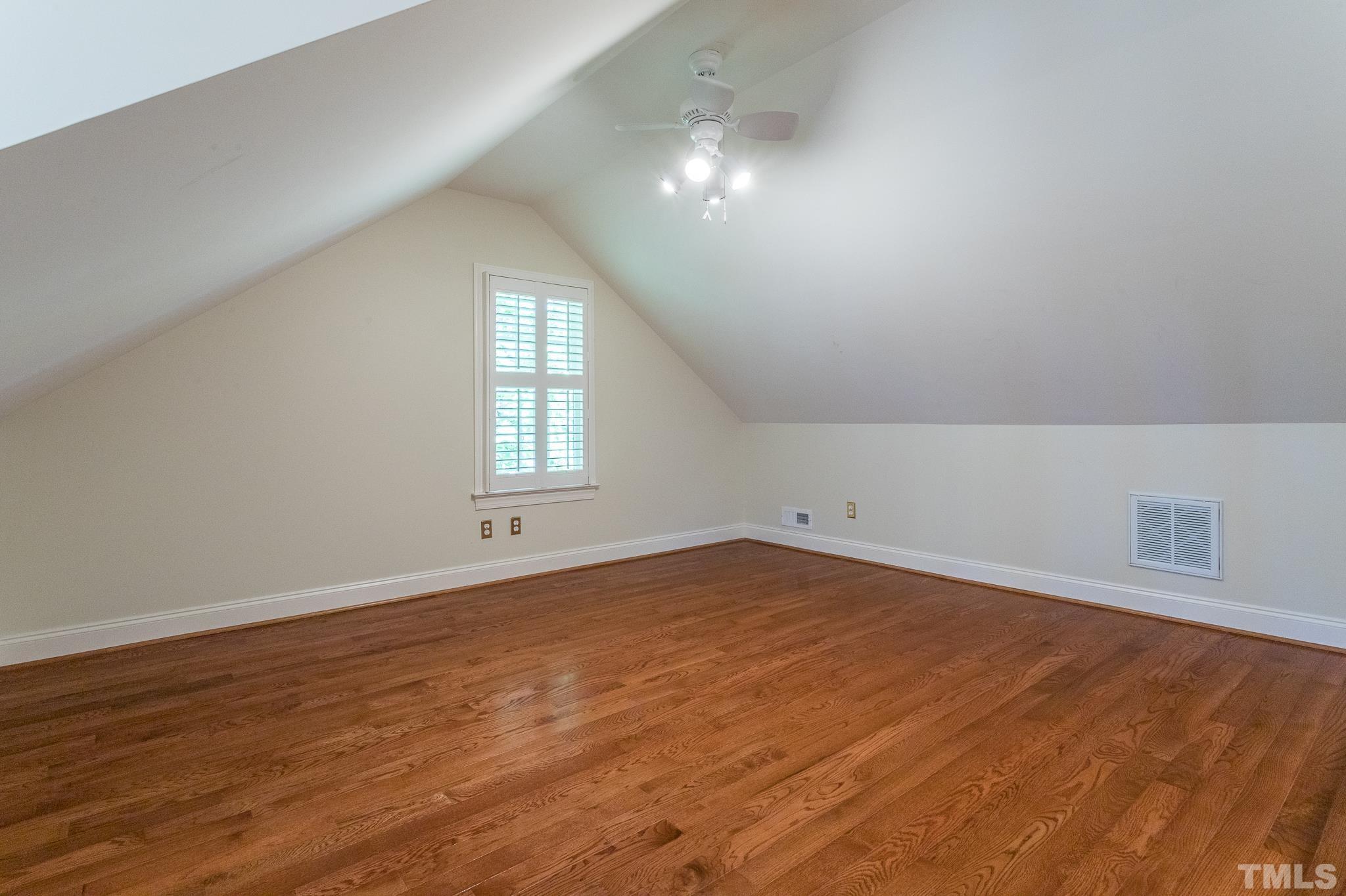 2700 Farnborough Road Raleigh, NC 27613 - Photo 31 of 36 wooden floor in an empty room with a window