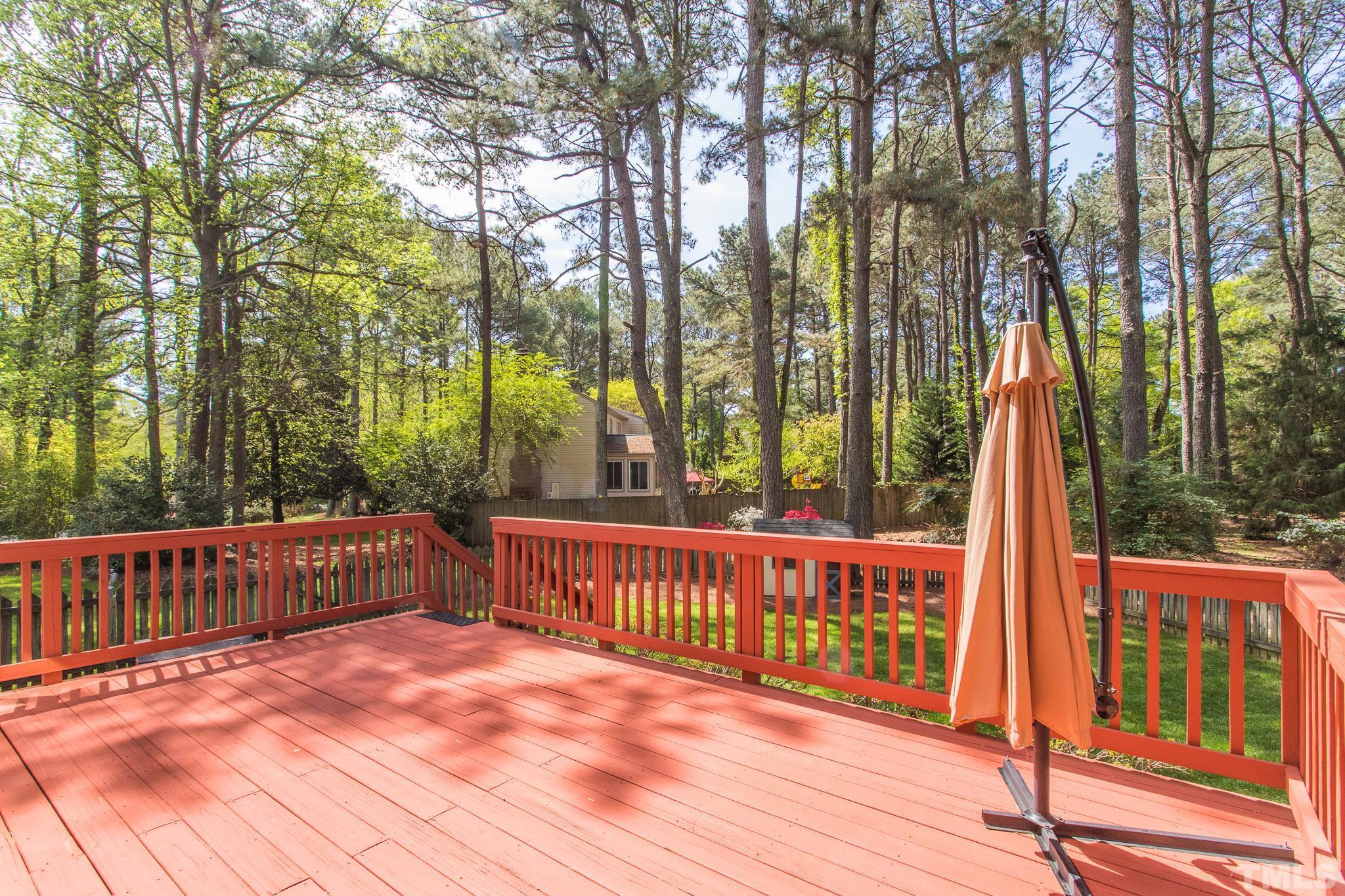 2700 Farnborough Road Raleigh, NC 27613 - Photo 10 of 36 a view of backyard with deck and outdoor seating
