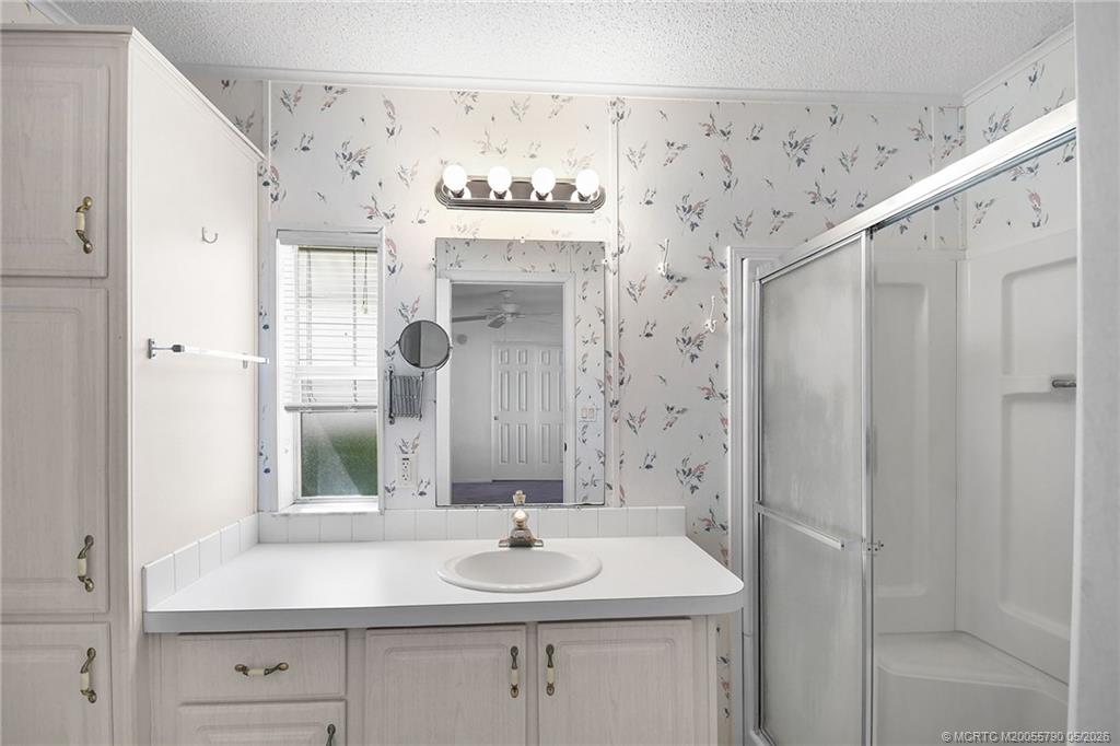 7149 Southeast Ridgeway Terrace Hobe Sound, FL 33455 - Photo 25 of 34 Primary bathroom