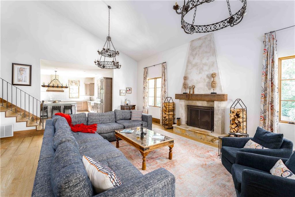 3118 West Roxboro Road Northeast Atlanta, GA 30324 - Photo 17 of 68 a living room with furniture a fireplace and a chandelier