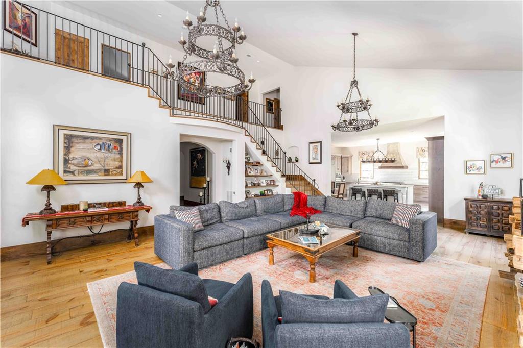 3118 West Roxboro Road Northeast Atlanta, GA 30324 - Photo 18 of 68 a living room with furniture a chandelier and a fireplace