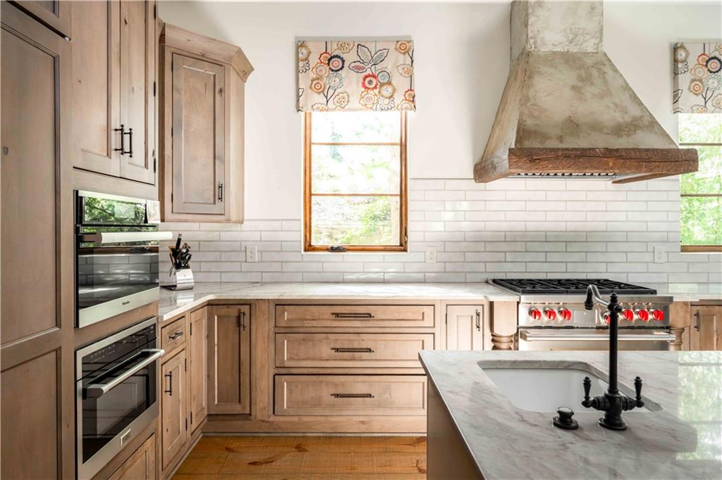 3118 West Roxboro Road Northeast Atlanta, GA 30324 - Photo 23 of 68 a kitchen with granite countertop a sink and a stove