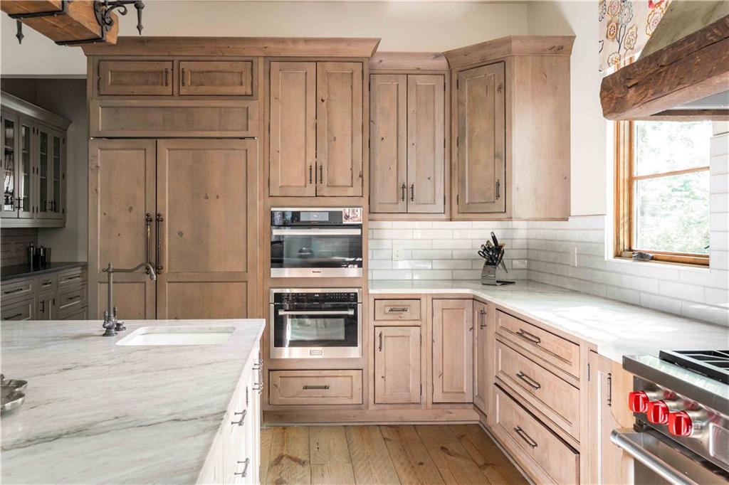 3118 West Roxboro Road Northeast Atlanta, GA 30324 - Photo 24 of 68 a kitchen with stainless steel appliances granite countertop a sink and cabinets