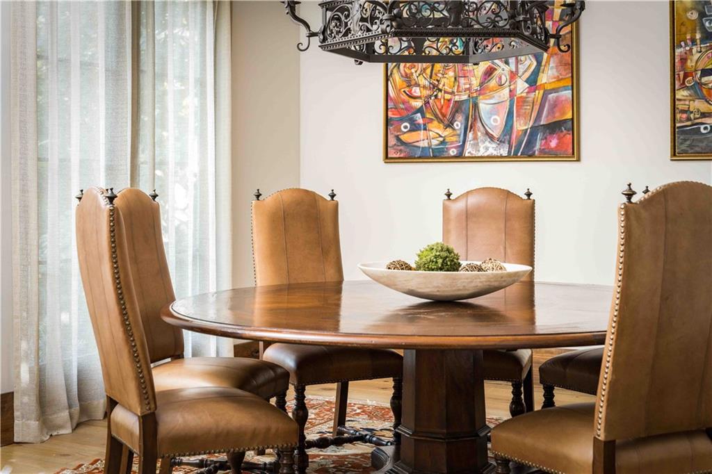 3118 West Roxboro Road Northeast Atlanta, GA 30324 - Photo 34 of 68 a view of a dining room with furniture and wooden floor
