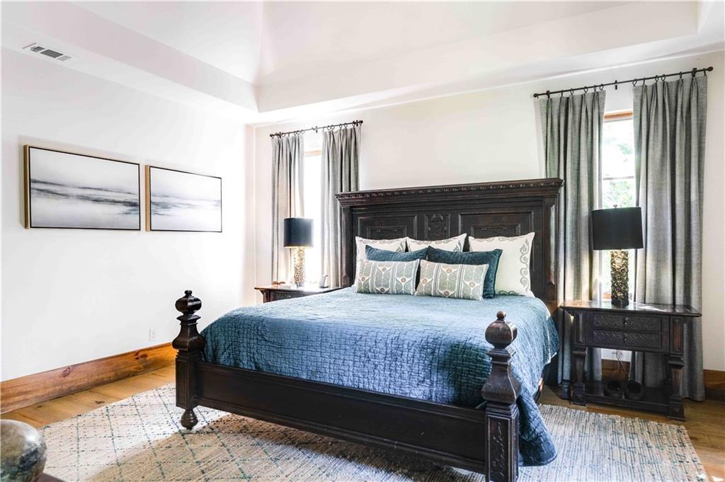 3118 West Roxboro Road Northeast Atlanta, GA 30324 - Photo 41 of 68 a bedroom with a bed and wooden floor