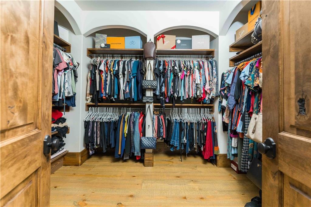 3118 West Roxboro Road Northeast Atlanta, GA 30324 - Photo 46 of 68 a view of walk in closet with clothes and shoes