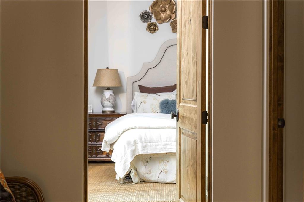 3118 West Roxboro Road Northeast Atlanta, GA 30324 - Photo 48 of 68 a bedroom with a bed and a mirror