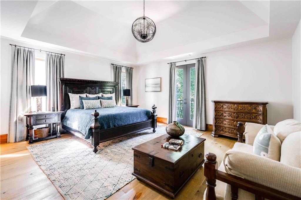 3118 West Roxboro Road Northeast Atlanta, GA 30324 - Photo 5 of 68 a bedroom with a bed a couch and dresser