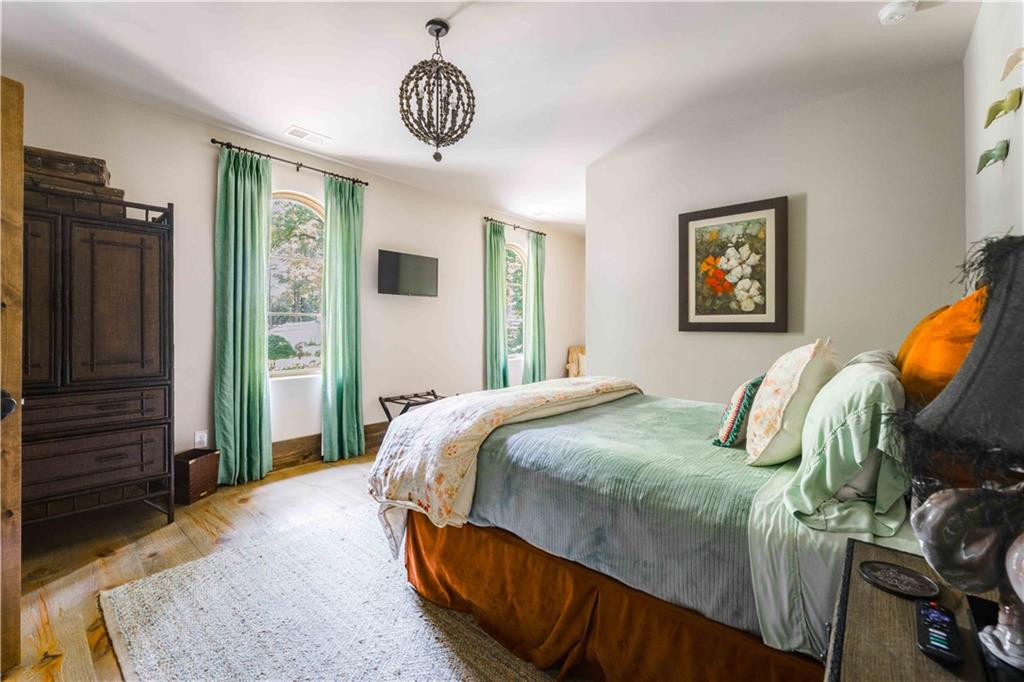 3118 West Roxboro Road Northeast Atlanta, GA 30324 - Photo 51 of 68 a bedroom with bed and wooden floor