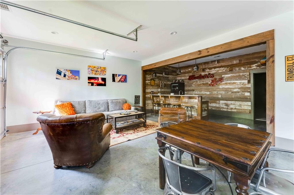 3118 West Roxboro Road Northeast Atlanta, GA 30324 - Photo 55 of 68 a room with furniture and a flat screen tv