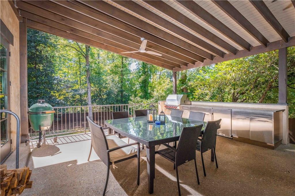 3118 West Roxboro Road Northeast Atlanta, GA 30324 - Photo 6 of 68 a view of a patio with a table chairs and backyard