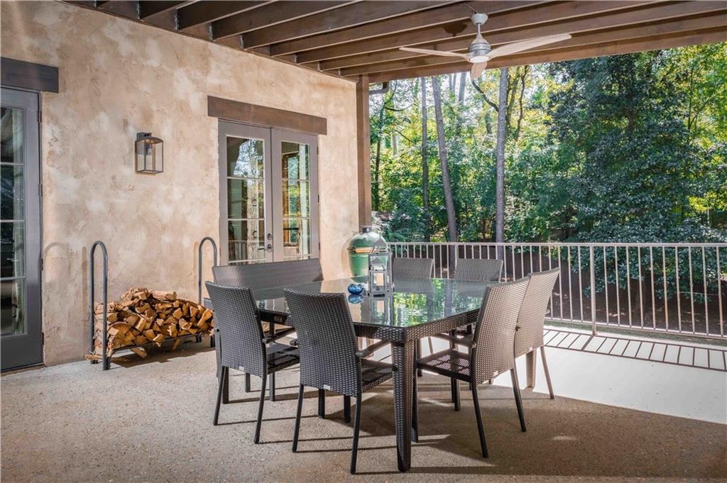 3118 West Roxboro Road Northeast Atlanta, GA 30324 - Photo 63 of 68 a view of a patio with a table and chairs