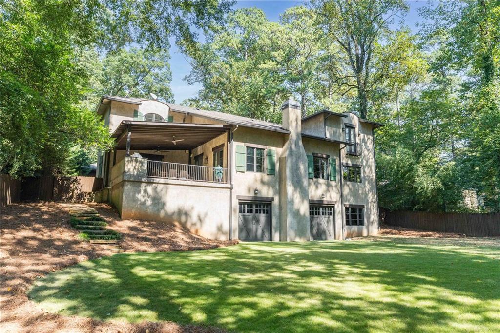 3118 West Roxboro Road Northeast Atlanta, GA 30324 - Photo 66 of 68 a view of a house with backyard and a tree