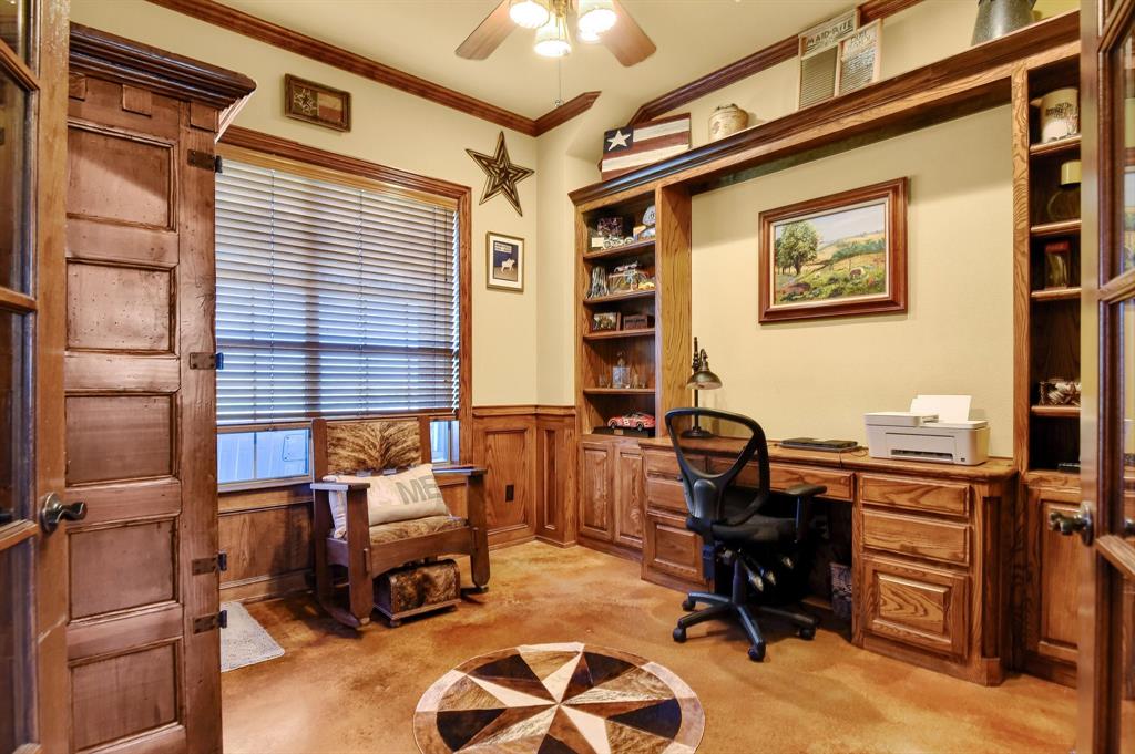 710 Highway 82 Bells, TX 75414 - Photo 15 of 40 a view of a workspace with furniture and a window
