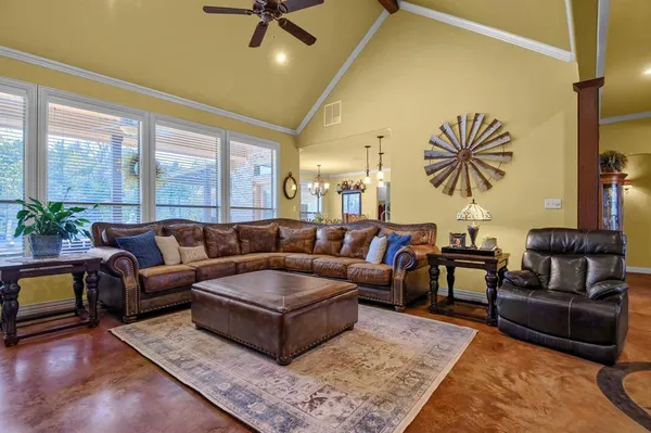 a living room with furniture and a rug