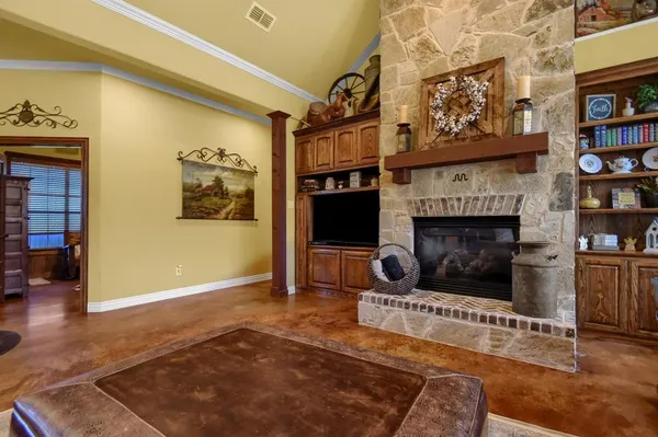 a living room with furniture and a fireplace