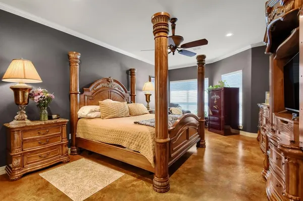 a bedroom with a bed and a mirror