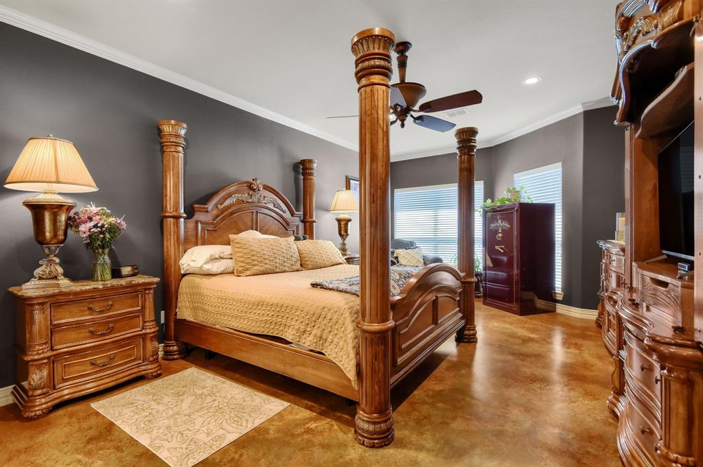 710 Highway 82 Bells, TX 75414 - Photo 20 of 40 a bedroom with a bed and a mirror