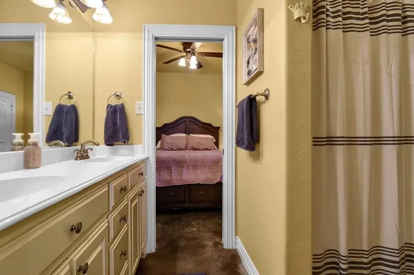 a bathroom with a double vanity sink and a mirror