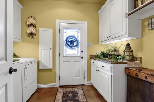 a kitchen with a refrigerator and a stove