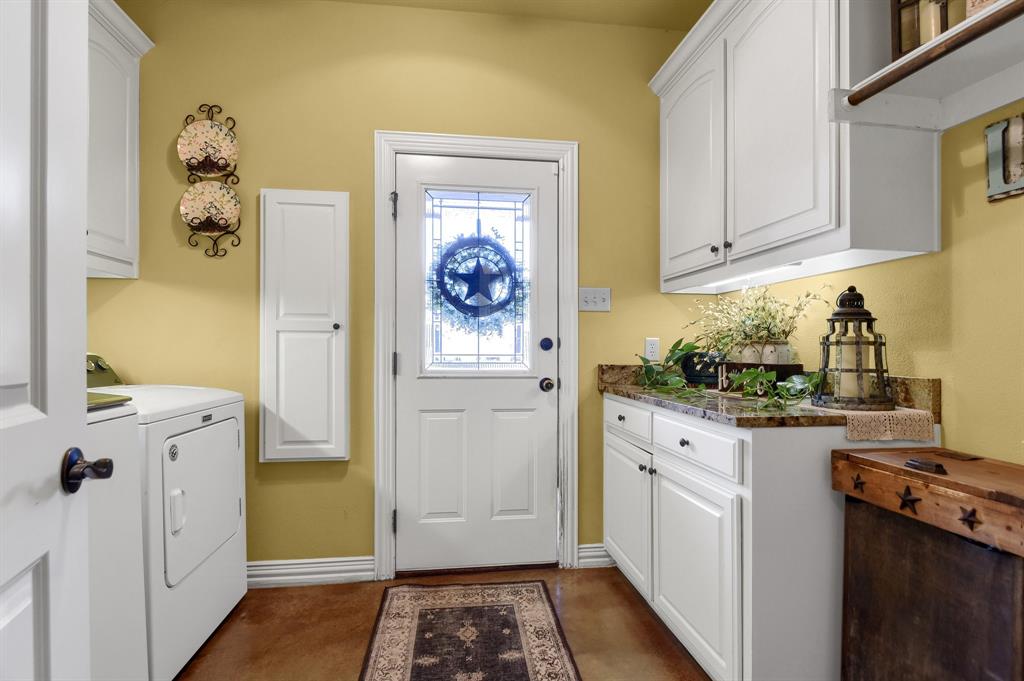 710 Highway 82 Bells, TX 75414 - Photo 27 of 40 a kitchen with a refrigerator and a stove