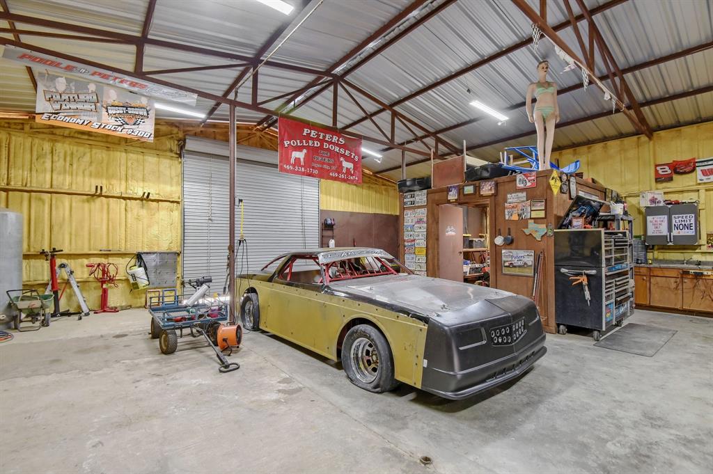 710 Highway 82 Bells, TX 75414 - Photo 36 of 40 a car and bike parked in a garage