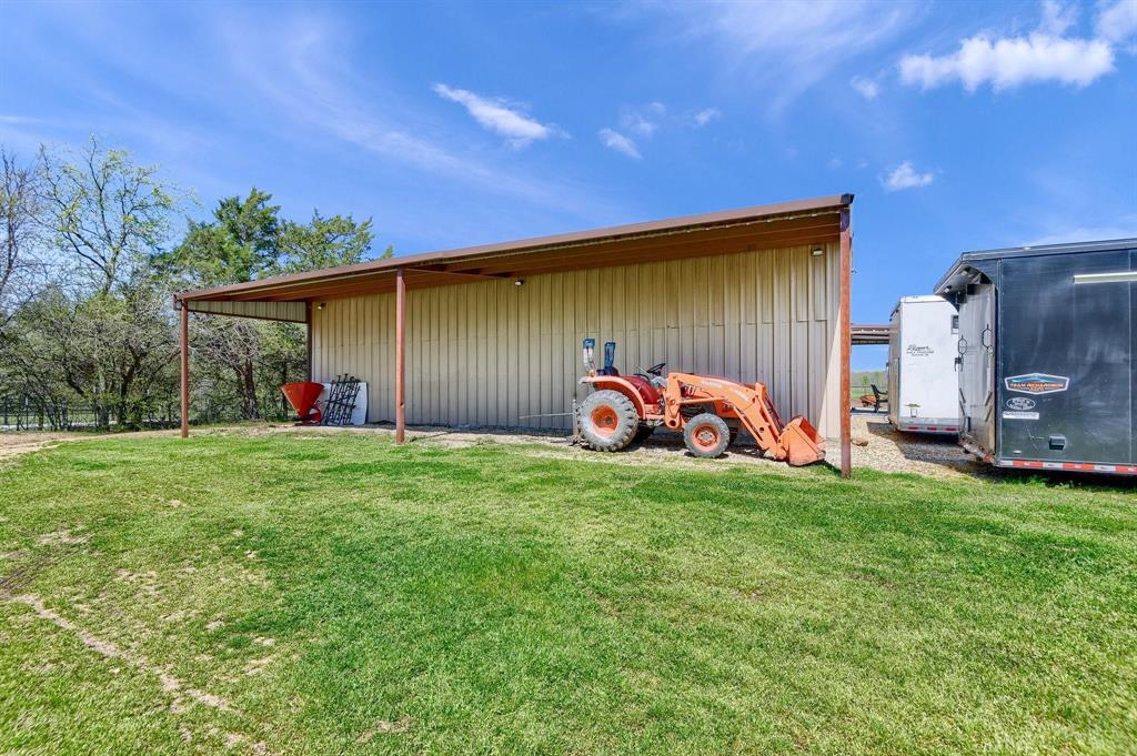 710 Highway 82 Bells, TX 75414 - Photo 37 of 40 a front view of a house with garden