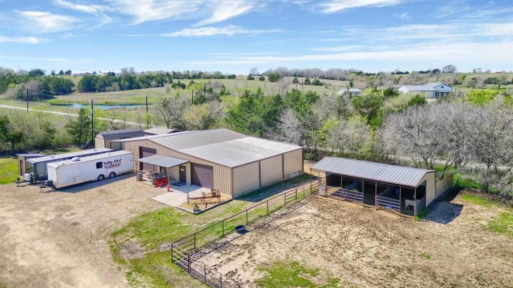 710 Highway 82 Bells, TX 75414 - Photo 8 of 40 a view of a house with big yard and large trees