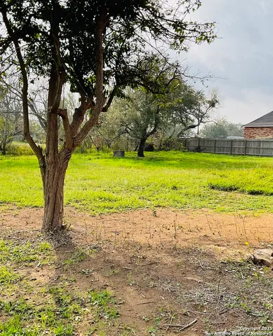 a swimming pool with an outdoor space and seating area