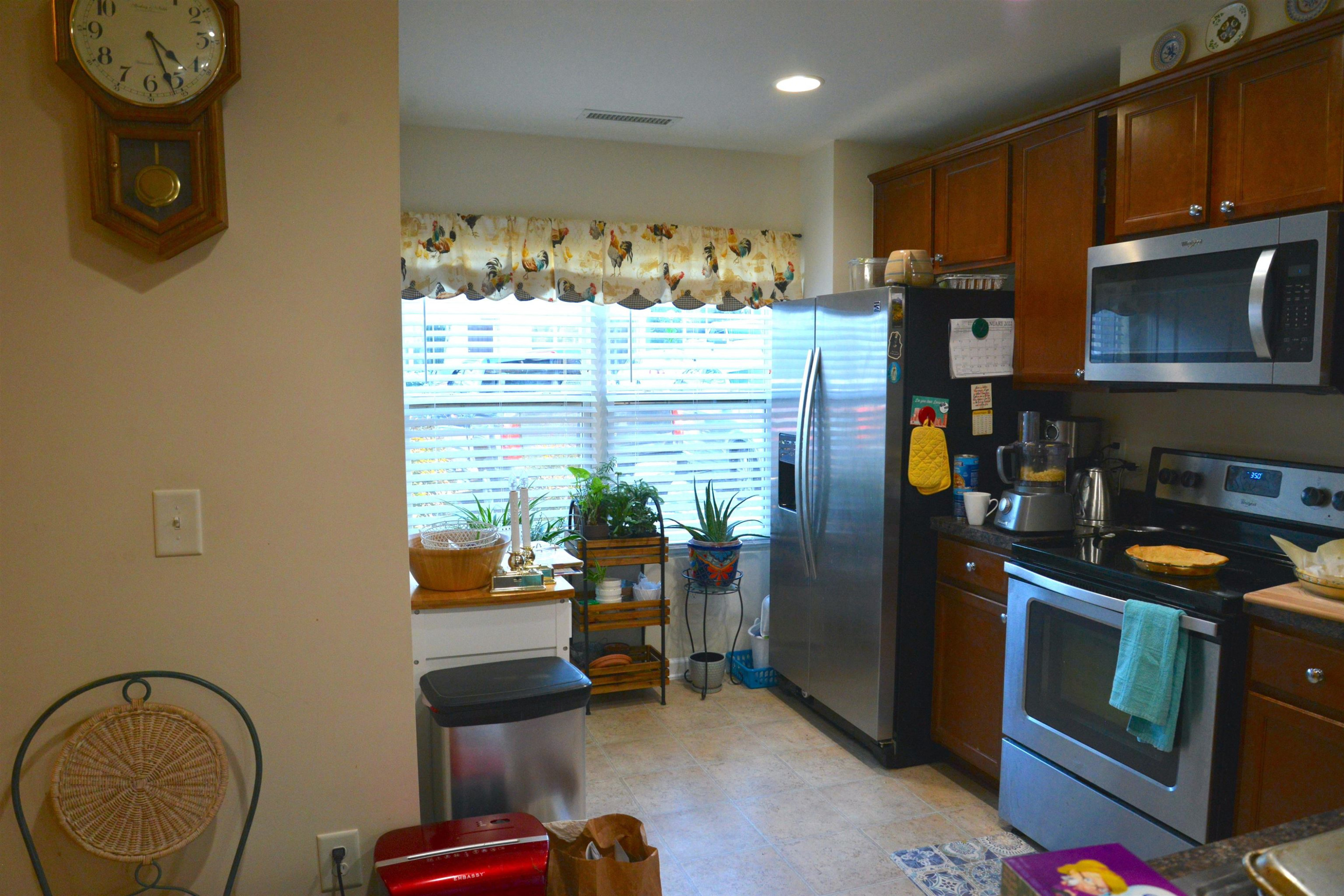 8533 Quarton Drive Raleigh, NC 27616 - Photo 19 of 20 a kitchen with stainless steel appliances granite countertop a refrigerator and a stove top oven