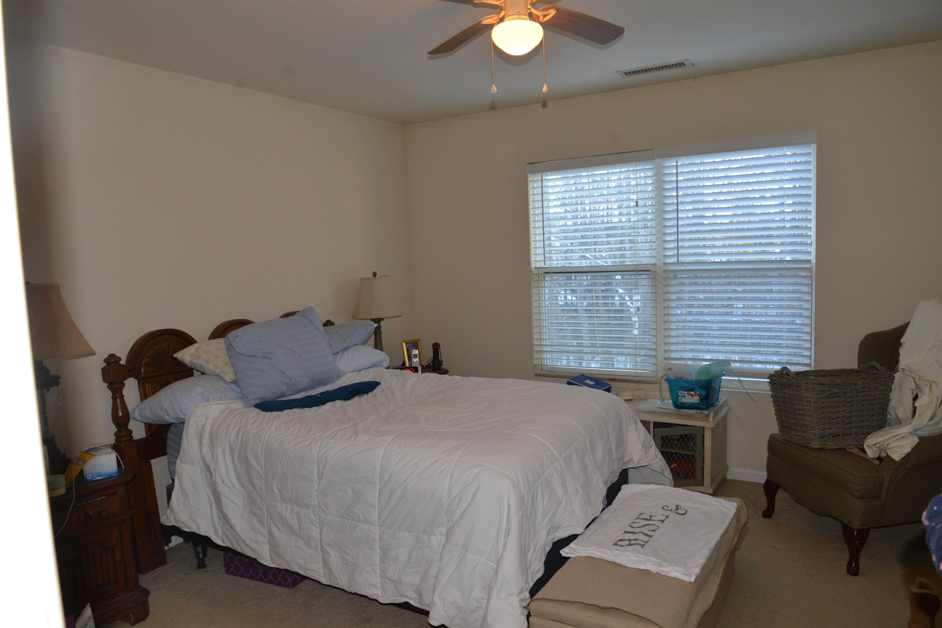 8533 Quarton Drive Raleigh, NC 27616 - Photo 6 of 20 a bed sitting in a bedroom next to a window