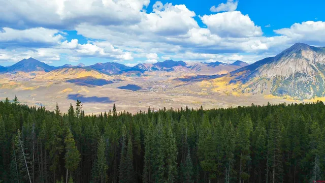 a view of a yard and mountain view